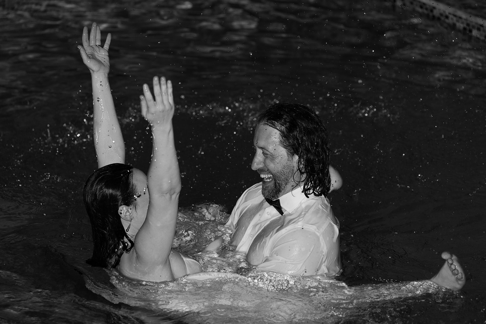 Black and White Bride and Groom Playing with Water in Pool Portraits After Elopement

Miami Destination Elopement Photographer