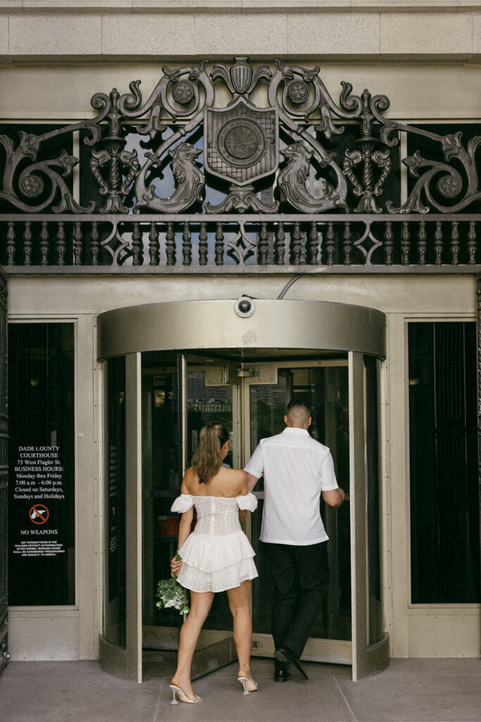 entering courthouse elopement pictures candid elopement pictures 

miami destination wedding and elopement photographers