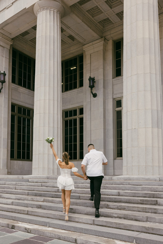 running up the stairs bouquet up courthouse elopement pictures

destination elopement and wedding photographer