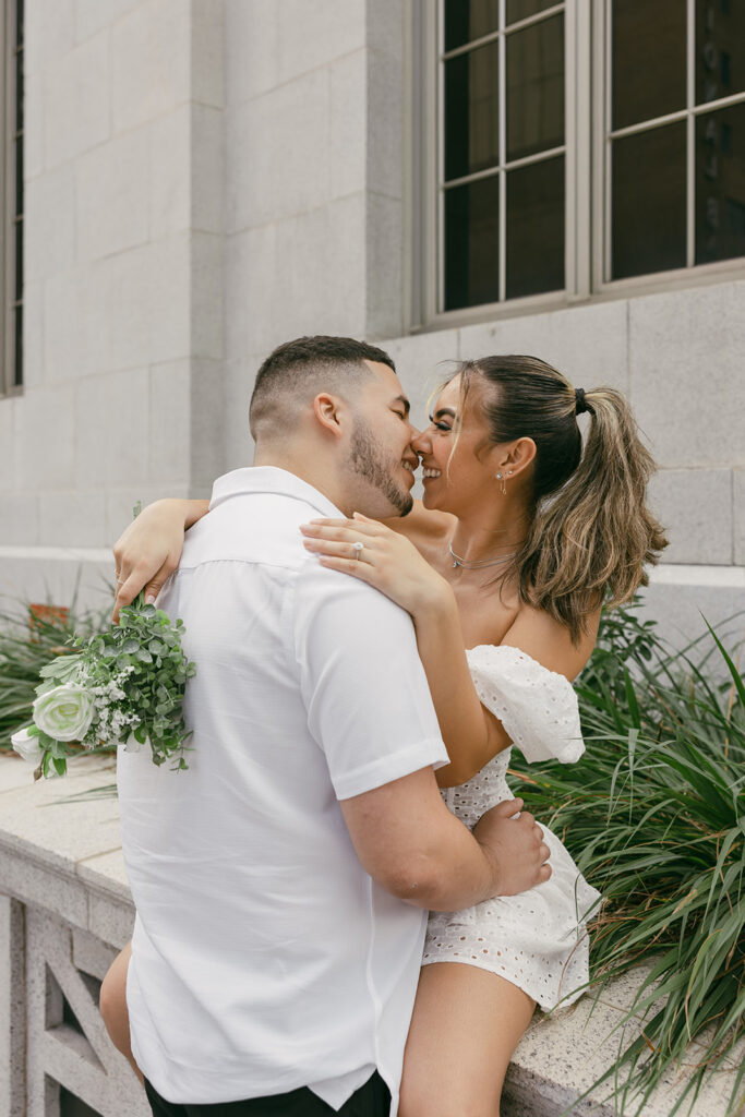 laughing newly weds couple poses 

destination elopement and wedding photographer