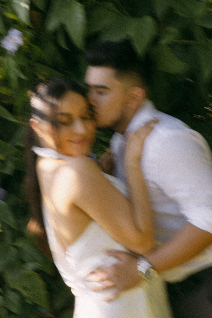 dreamy garden engagement shoot motion blur couple poses destination wedding photographer