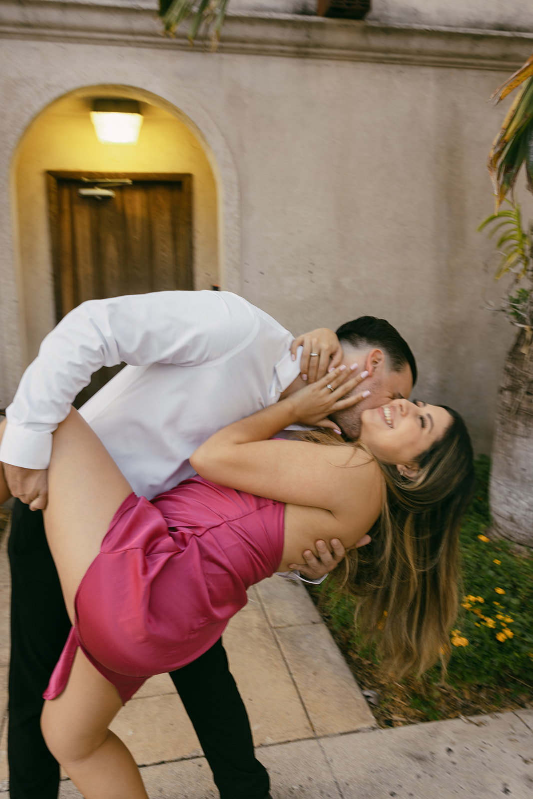 blurry kissing romantic courthouse engagement session motion blur couple miami elopement photographer