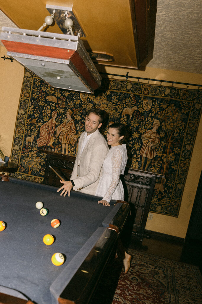 Elopement Pictures Spain Wedding Photographer fun pool table bride and groom pictures