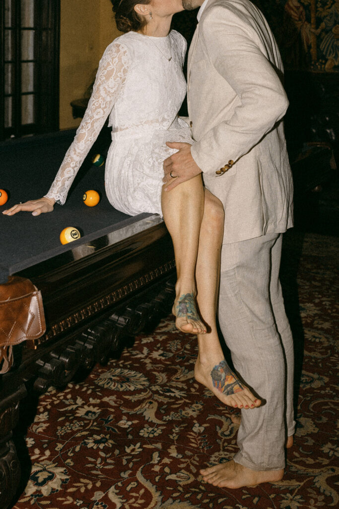 Elopement Pictures Spain Wedding Photographer kissing pool table bride and groom pictures