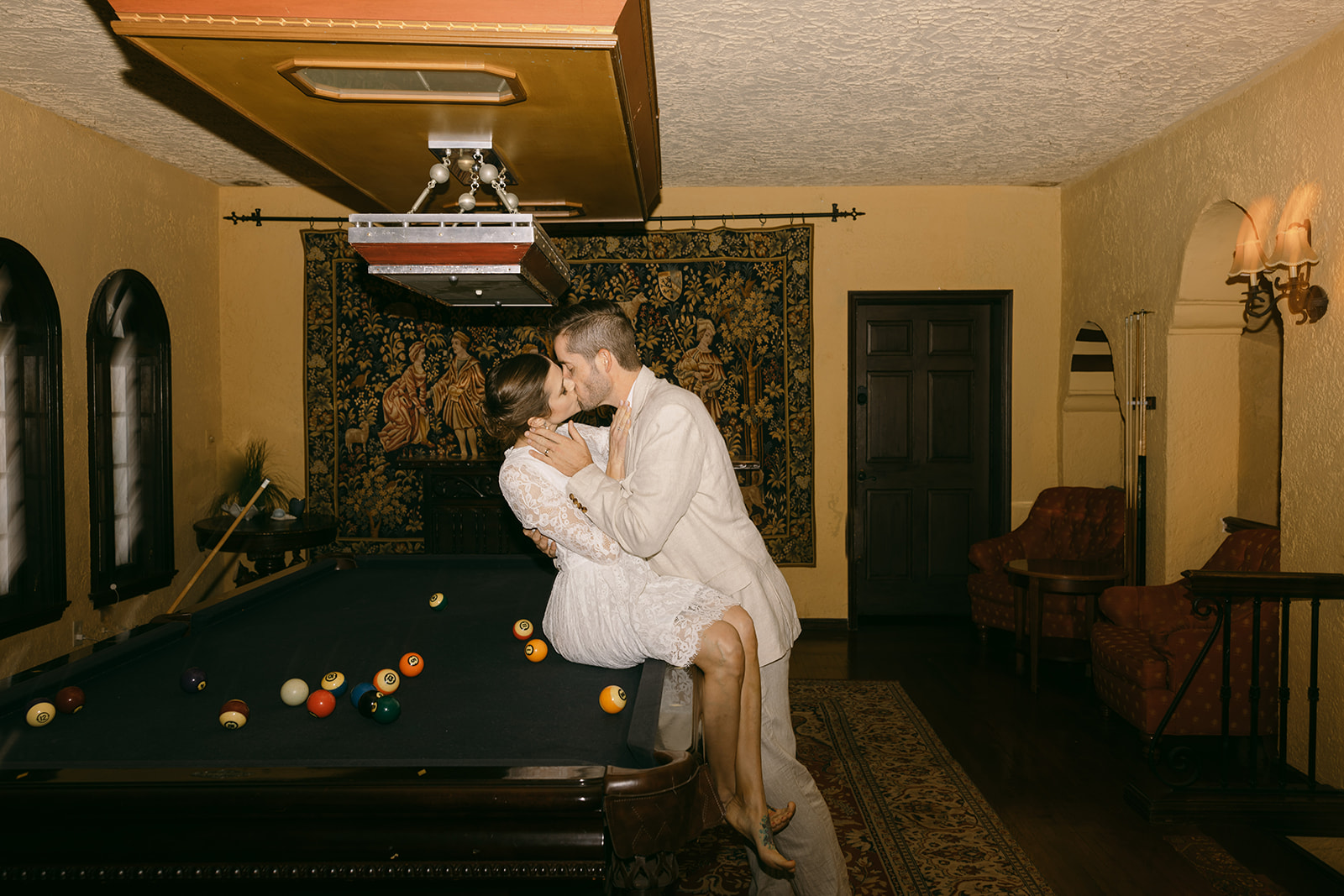 Elopement Pictures Spain Wedding Photographer kissing pool table bride and groom pictures