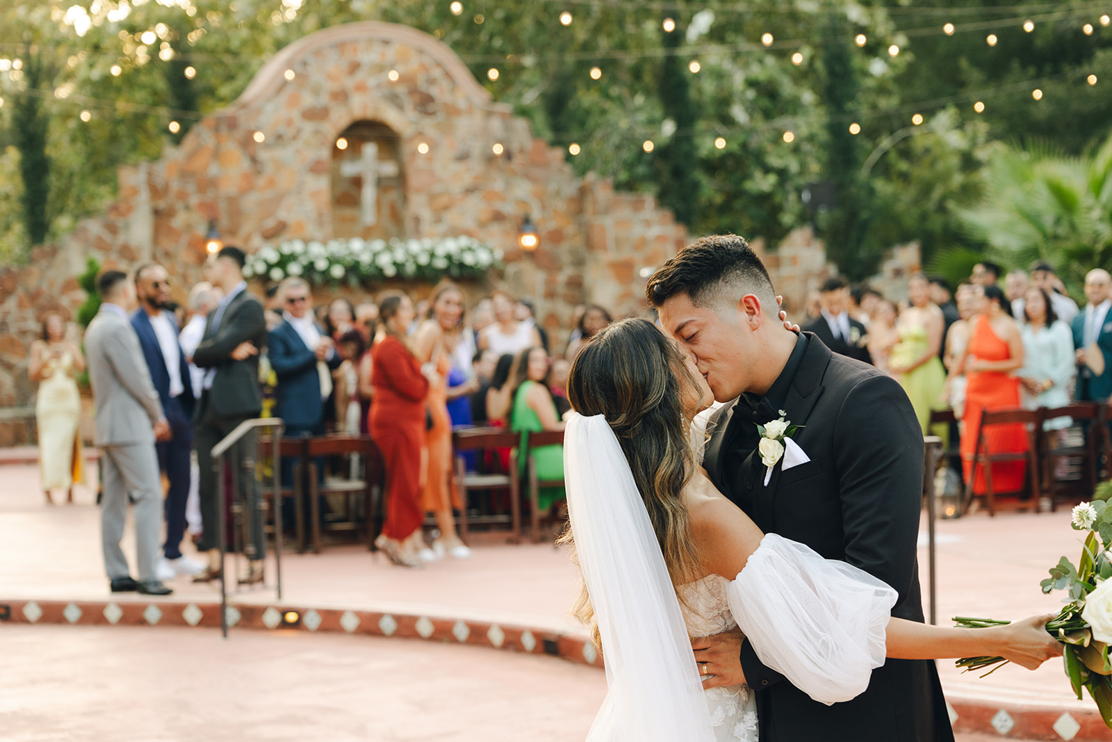 Texas Wedding Photographer Ceremony Moments Kissing Newly Weds