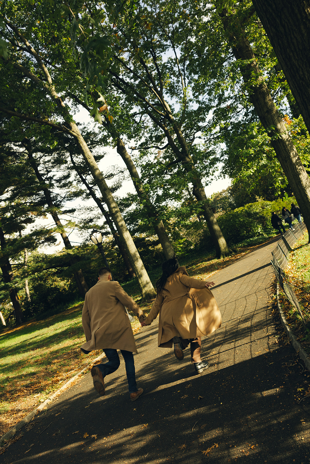 nyc central park fall couples session new york wedding photographer engagement session new york city wedding photographer running couple