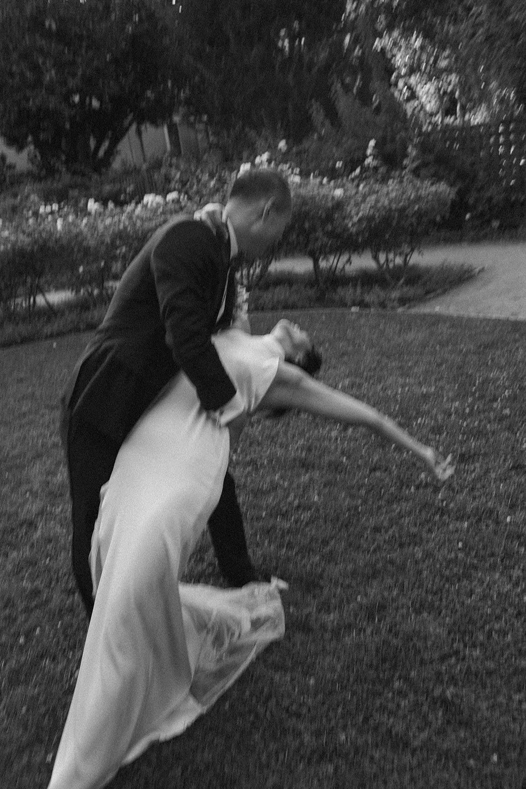 Documentary Wedding Photographer Playful Newly Wed Portraits in Palo Alto California Wedding Photographer Motion Blur Black and White