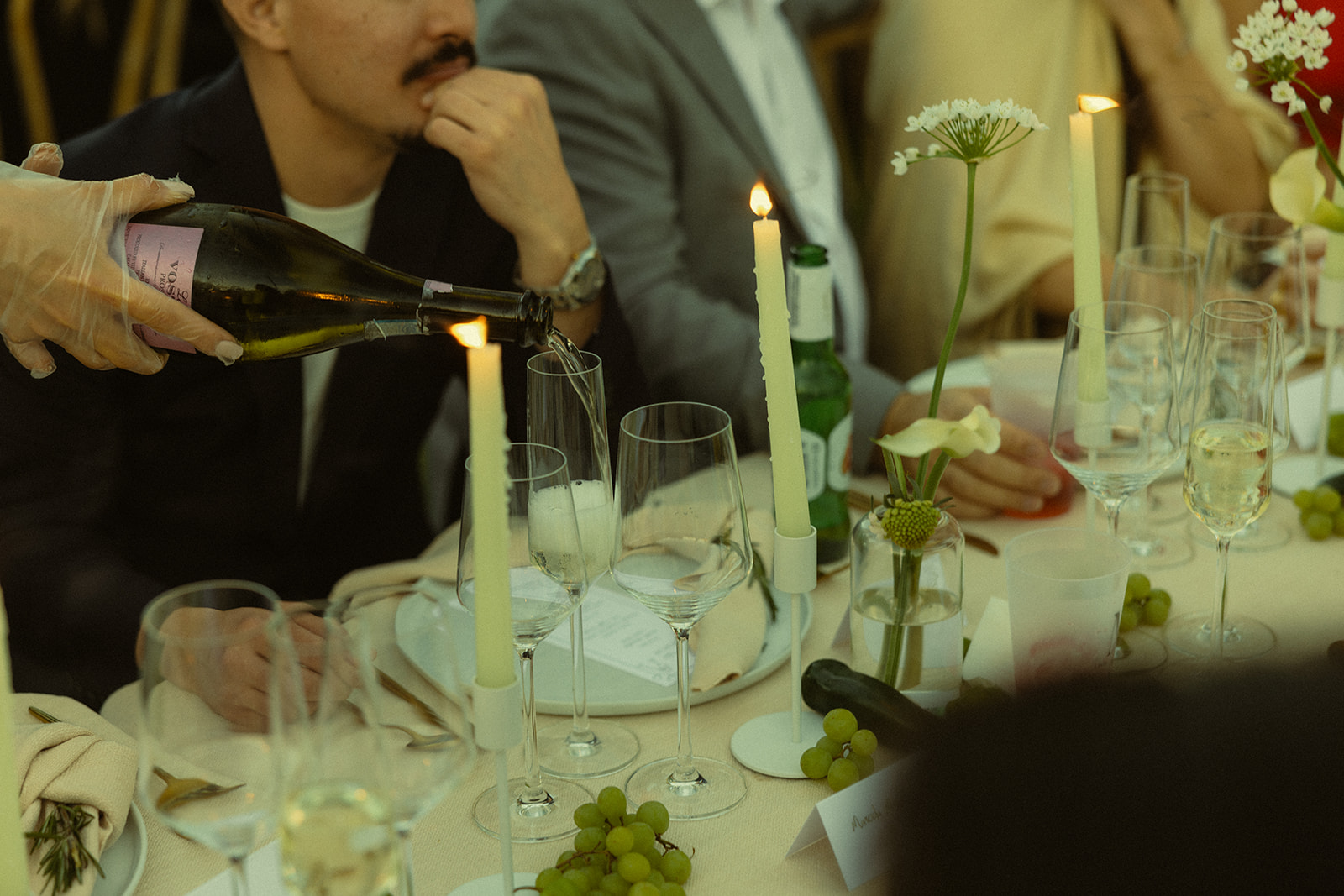 documentary serving wine during dinner and speeches dreamy and elevated intimate backyard wedding by Aileen Ayala Photography