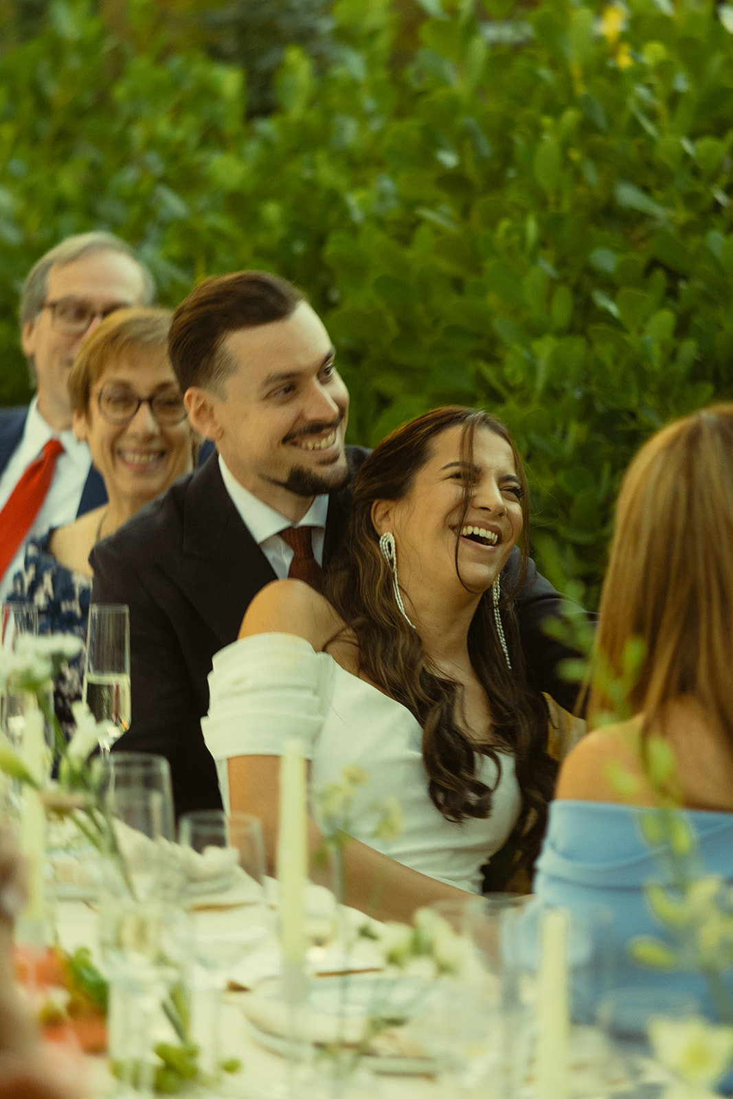 documentary laughing bride and groom reactions dinner and speeches dreamy and elevated intimate backyard wedding by Aileen Ayala Photography