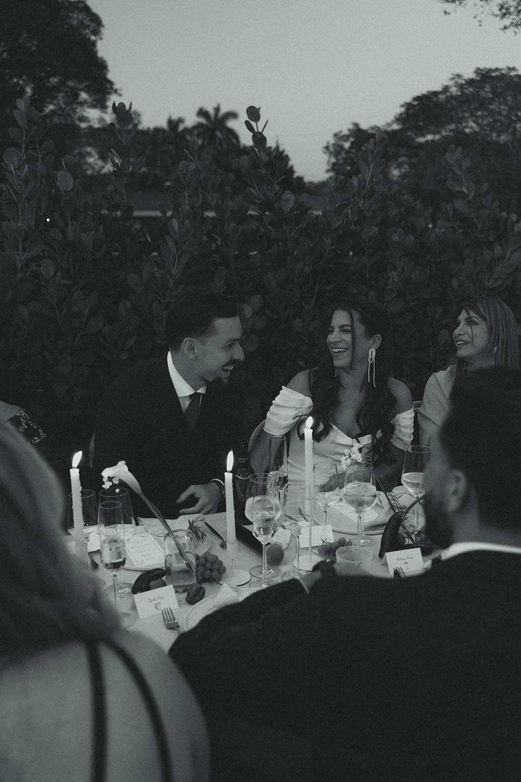 documentary bride and groom reactions dinner and speeches dreamy and elevated intimate backyard wedding by Aileen Ayala Photography b&W