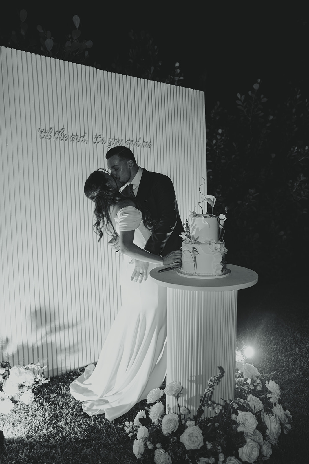 fun cake cutting dreamy and elevated intimate backyard wedding by Aileen Ayala Photography black and white