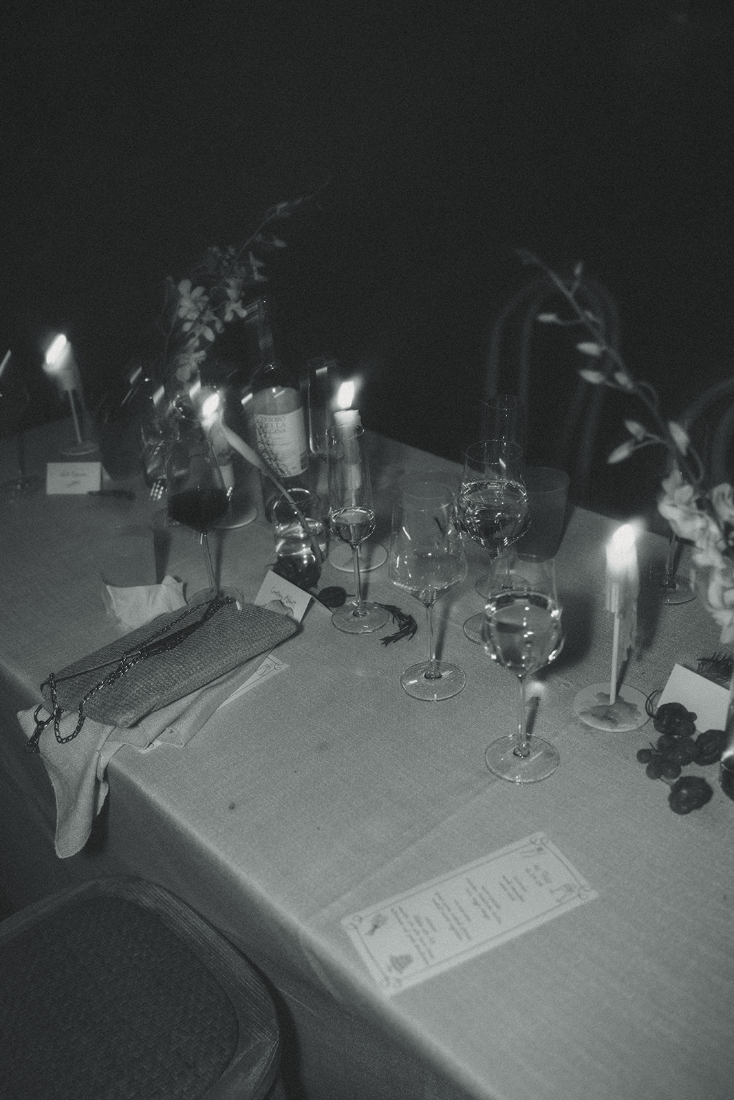 messy tablescape post dinner and speeches dreamy and elevated intimate backyard wedding by Aileen Ayala Photography b&W motion blur