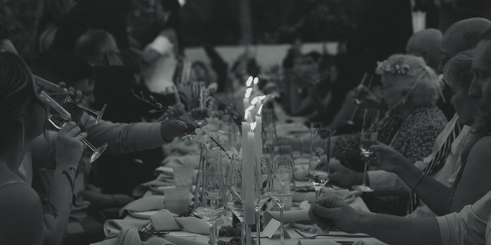 documentary candle lit dinner dreamy and elevated intimate backyard wedding by Aileen Ayala Photography black and white guests cheering and drinking champagne