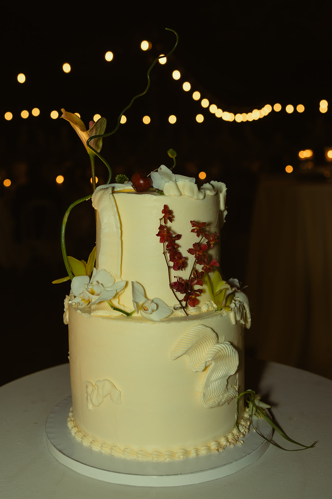 Artsy Wedding Cake Florals and Orchid Decor dreamy and elevated intimate backyard wedding by Aileen Ayala Photography