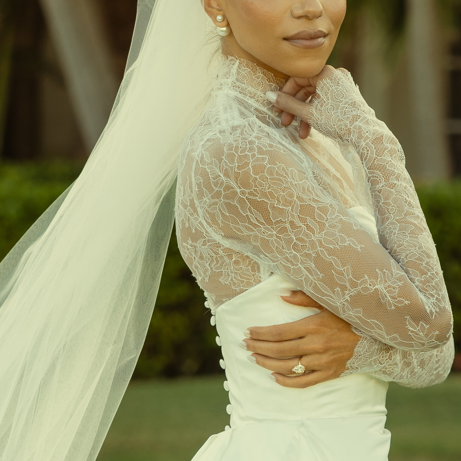 Editorial BRIDES Magazine Vibe Solo Up Close Bridal Details Portraits in JW Turnberry Miami Golf Course. Elegant Mesh Turtle Neck Essense of Australia Wedding Dress. Pearl Stud Earrings. Bridal Soft Glam.