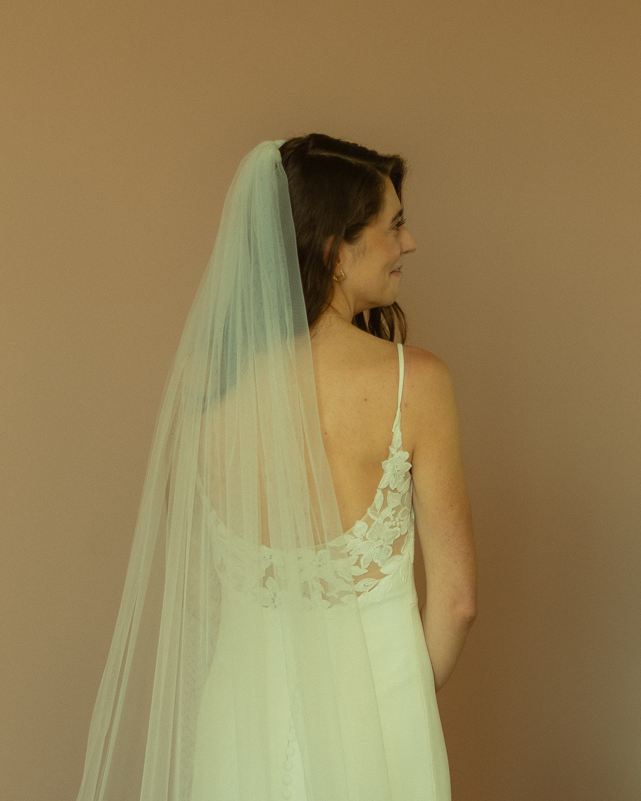 The Don CeSar Wedding Bride Getting Ready Anthropology Wedding Dress Up Close Bridal Portrait Lace Floral Back Detail Smiling Bride