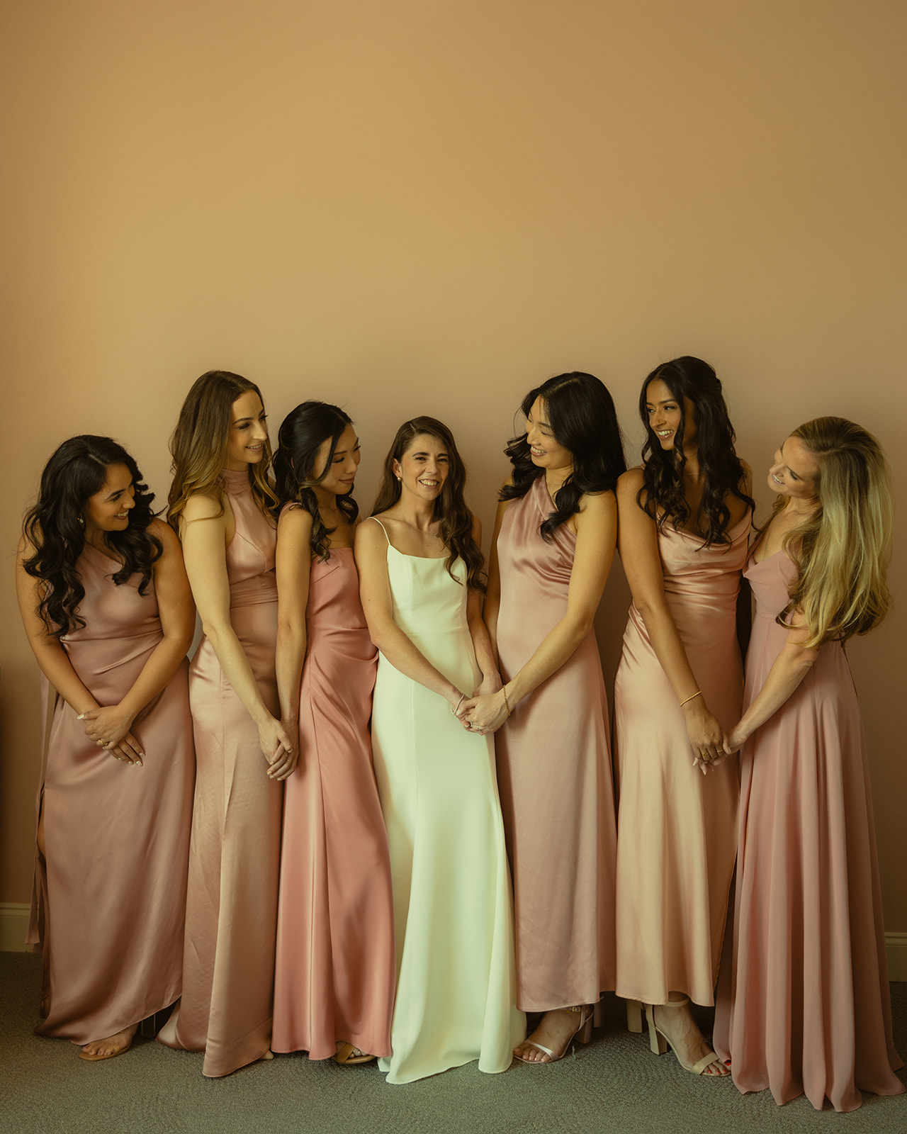 The Don CeSar Wedding Bridesmaid Pictures Satin Pastel Pink Bridesmaid Dresses Bride Anthropology Wedding Dress Hugging Eachother