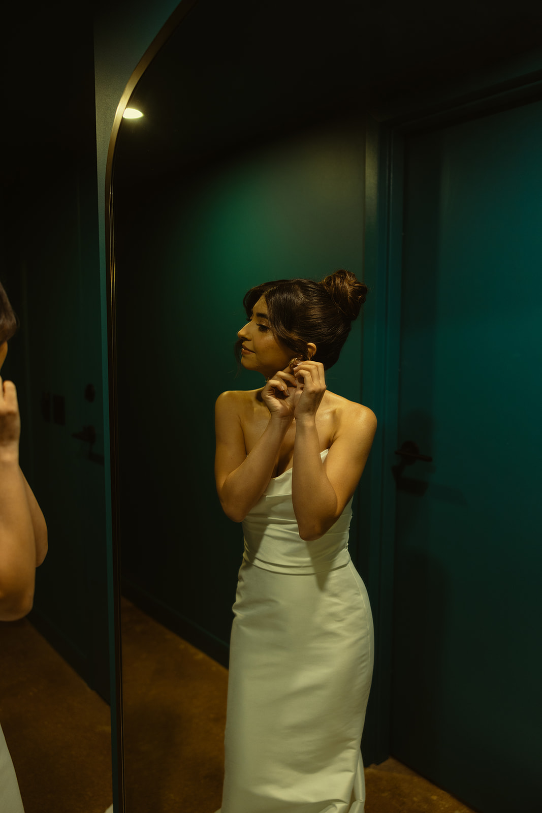 Bride Putting Earrings On Timeless Wedding in Mayfair Hotel & Garden