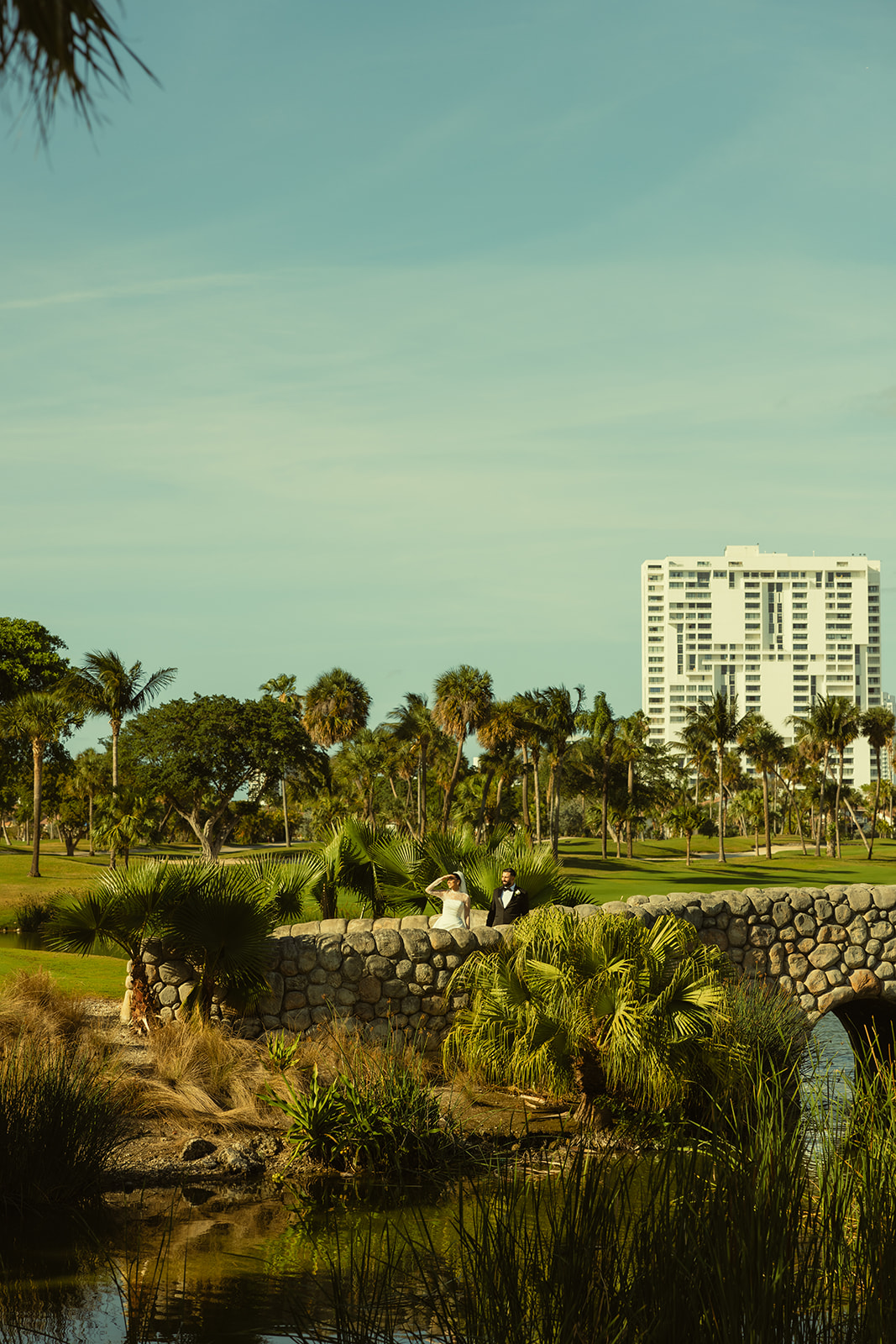 Bride and Groom Candid on Golf Course Bride in JW Marriott Turnberry in Miami Florida. Documentary Wedding Photographer