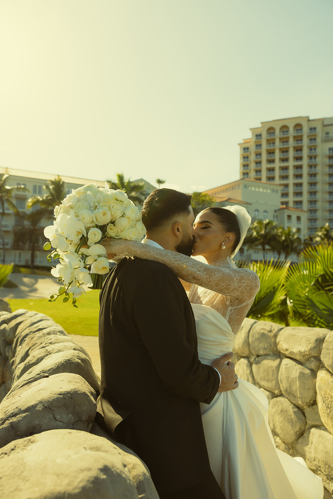 Editorial and Elegant Bride and Groom  Kissing Portrait in JW Marriott Turnberry in Miami Florida. Documentary Wedding Photographer