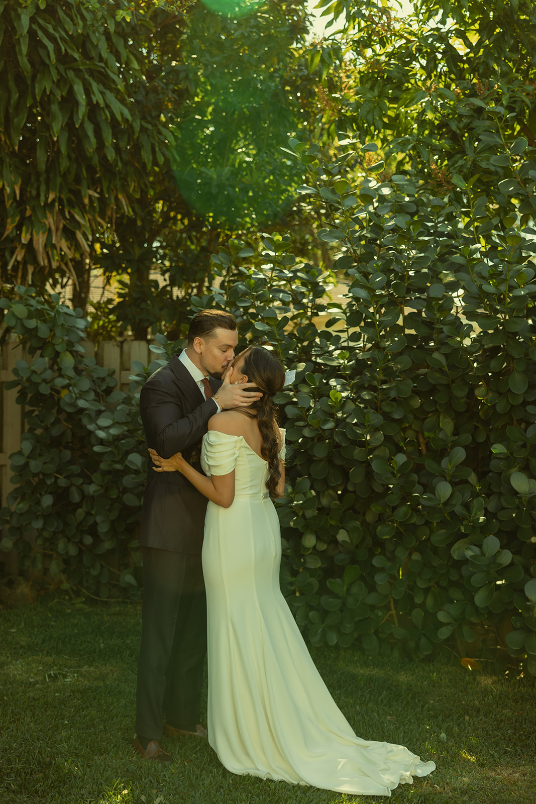 Kissing Bride & Groom Vow Exchange dreamy and elevated intimate backyard wedding by Aileen Ayala Photography