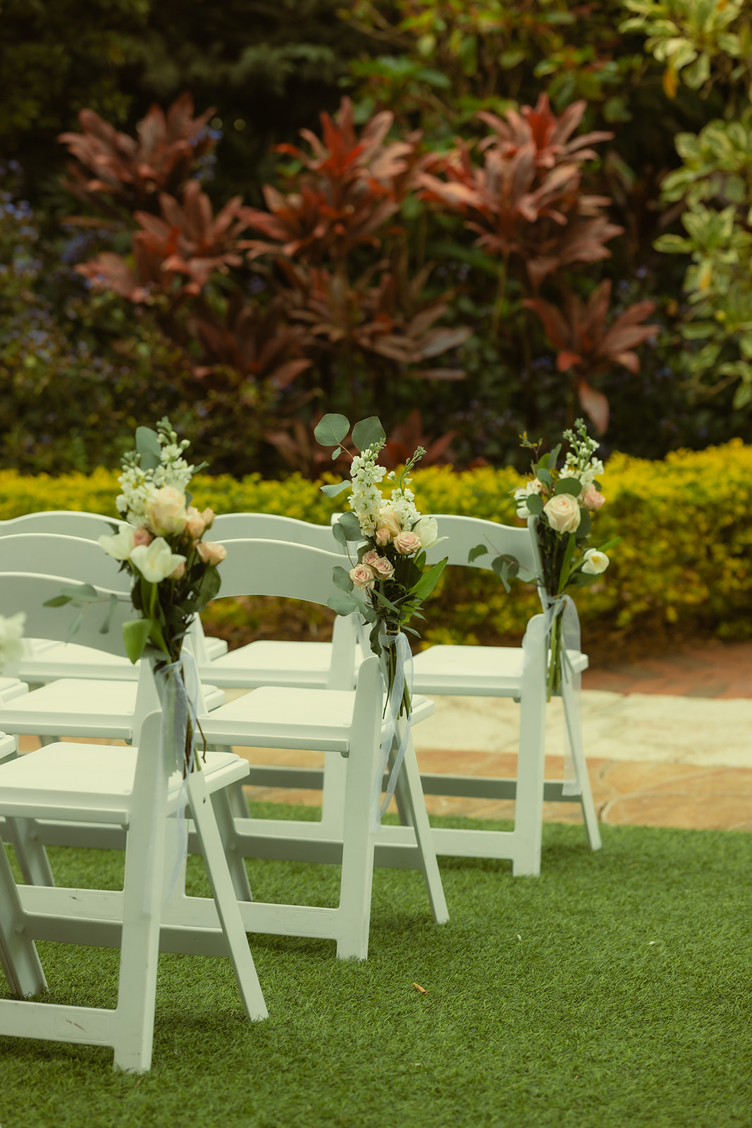 The Sunken Gardens in St.Petersburg Wedding Ceremony Floral Details. White and Pink Roses as center wedding aisle arrangements