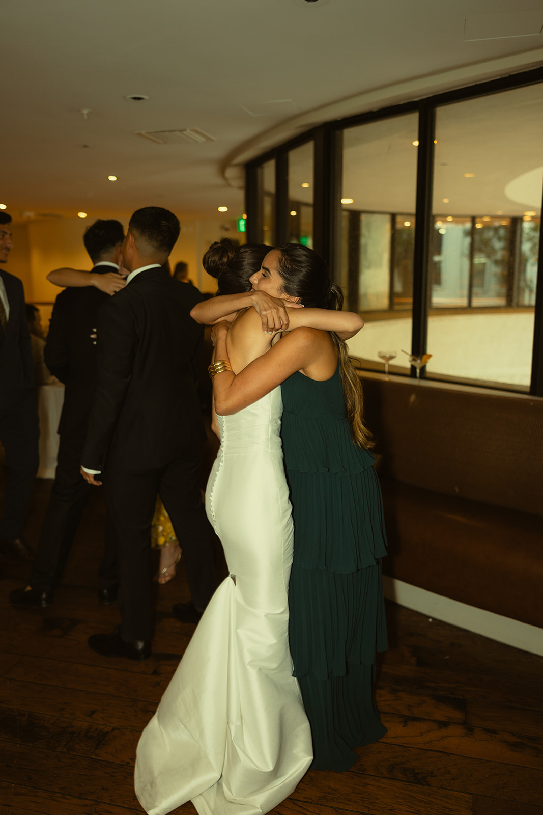 Cocktail Hour Candids Bride Hugging Guests Timeless Wedding in Mayfair Hotel & Garden