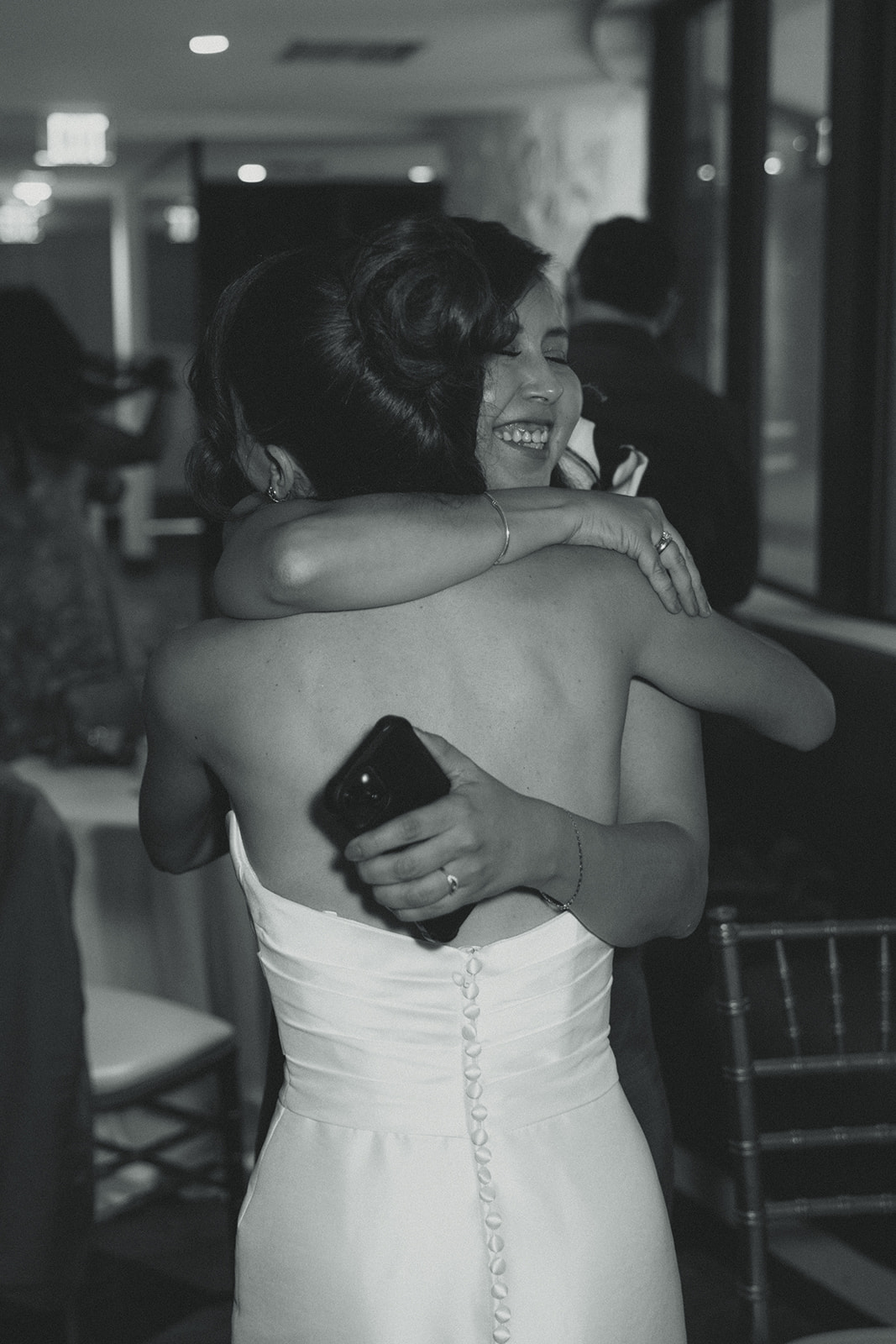 Cocktail Hour Candids Bride hugging Guests Black and White Timeless Wedding in Mayfair Hotel & Garden