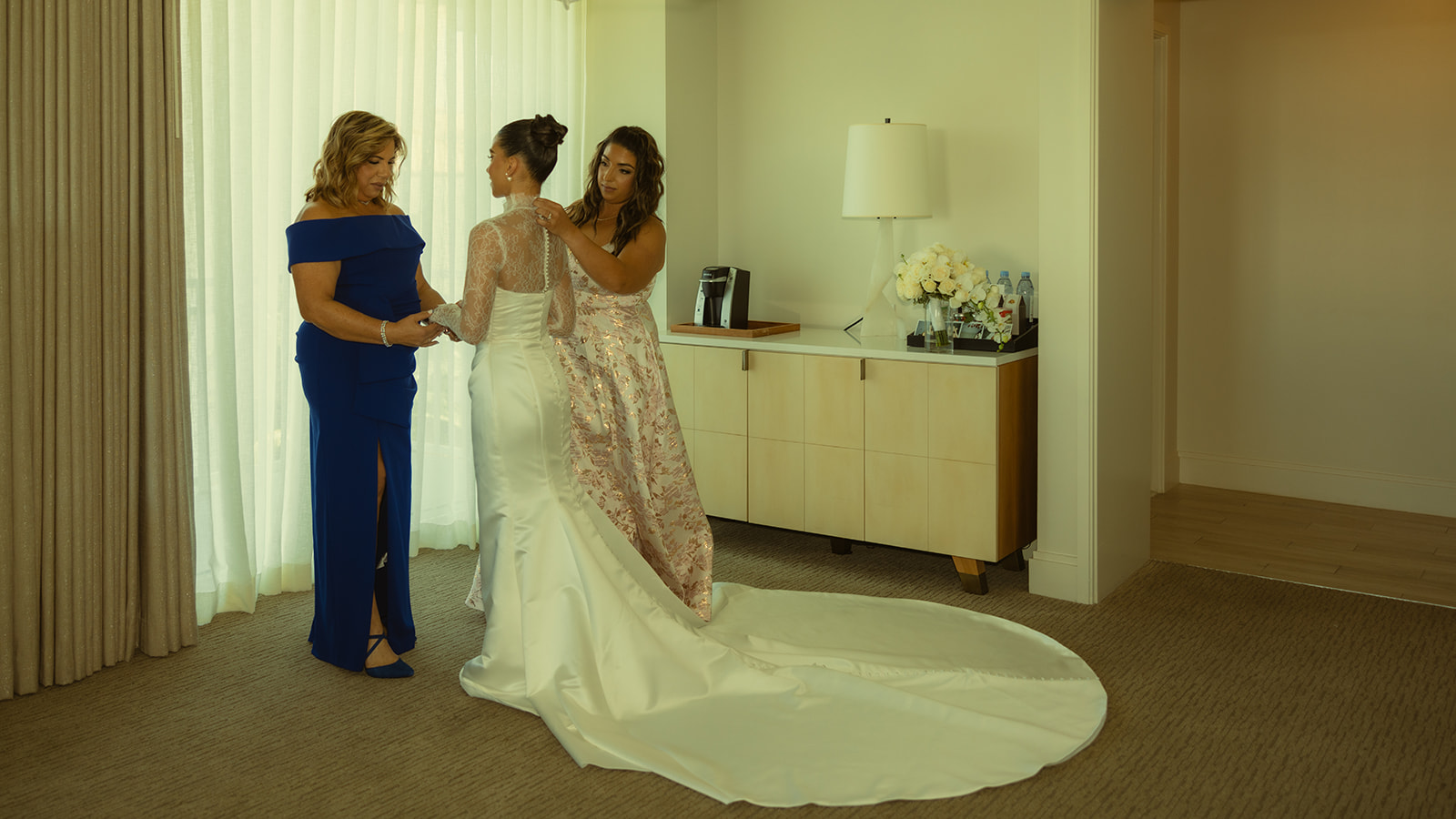 Mom and Sister fixing Brides Wedding Dress Turtle Nexl JW Miami Turnberry Resort & Spa in her Essense of Australia Wedding Dress