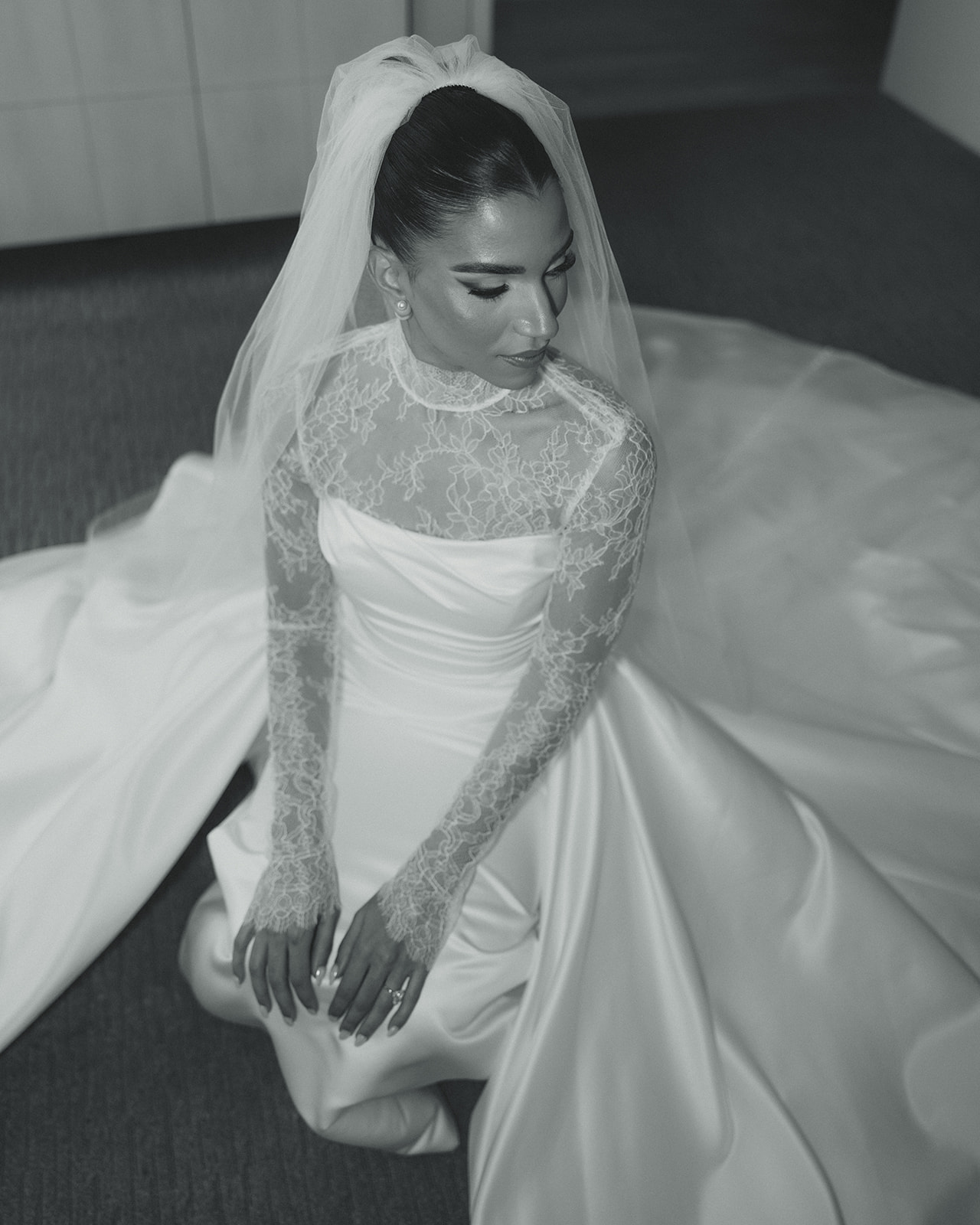 Bride Solo Portraits in Australia of Essense wedding dress with Mesh Turtle Neck at the JW Turnberry Resort in Aventura Florida Big Pearl Earring Studs Black and White 