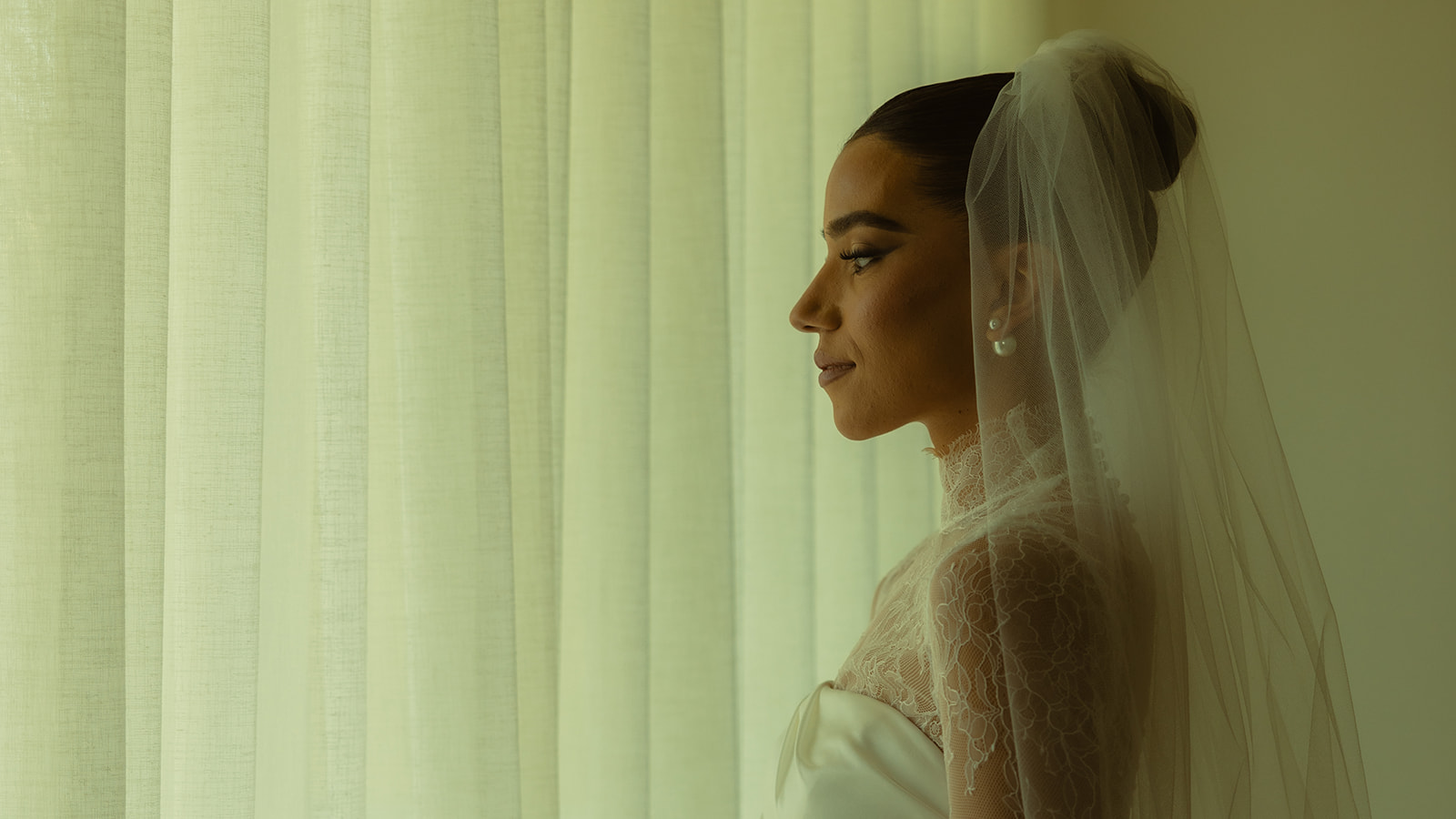 Gazing Bride Solo Portraits in Australia of Essense wedding dress with Mesh Turtle Neck at the JW Turnberry Resort in Aventura Florida Big Pearl Earring Studs 