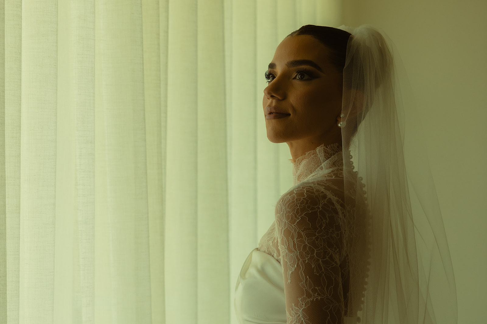 Gazing Bride Solo Portraits in Australia of Essense wedding dress with Mesh Turtle Neck at the JW Turnberry Resort in Aventura Florida Big Pearl Earring Studs 