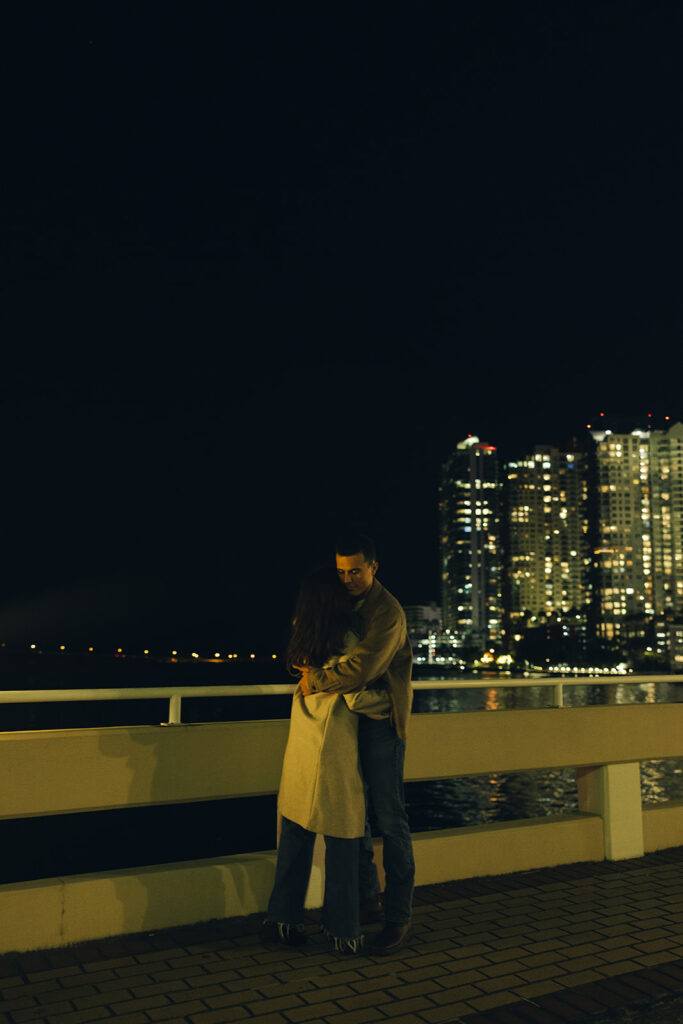 Documentary City Lights at Night Hugging Couple Engagement Session In Brickell Miami 