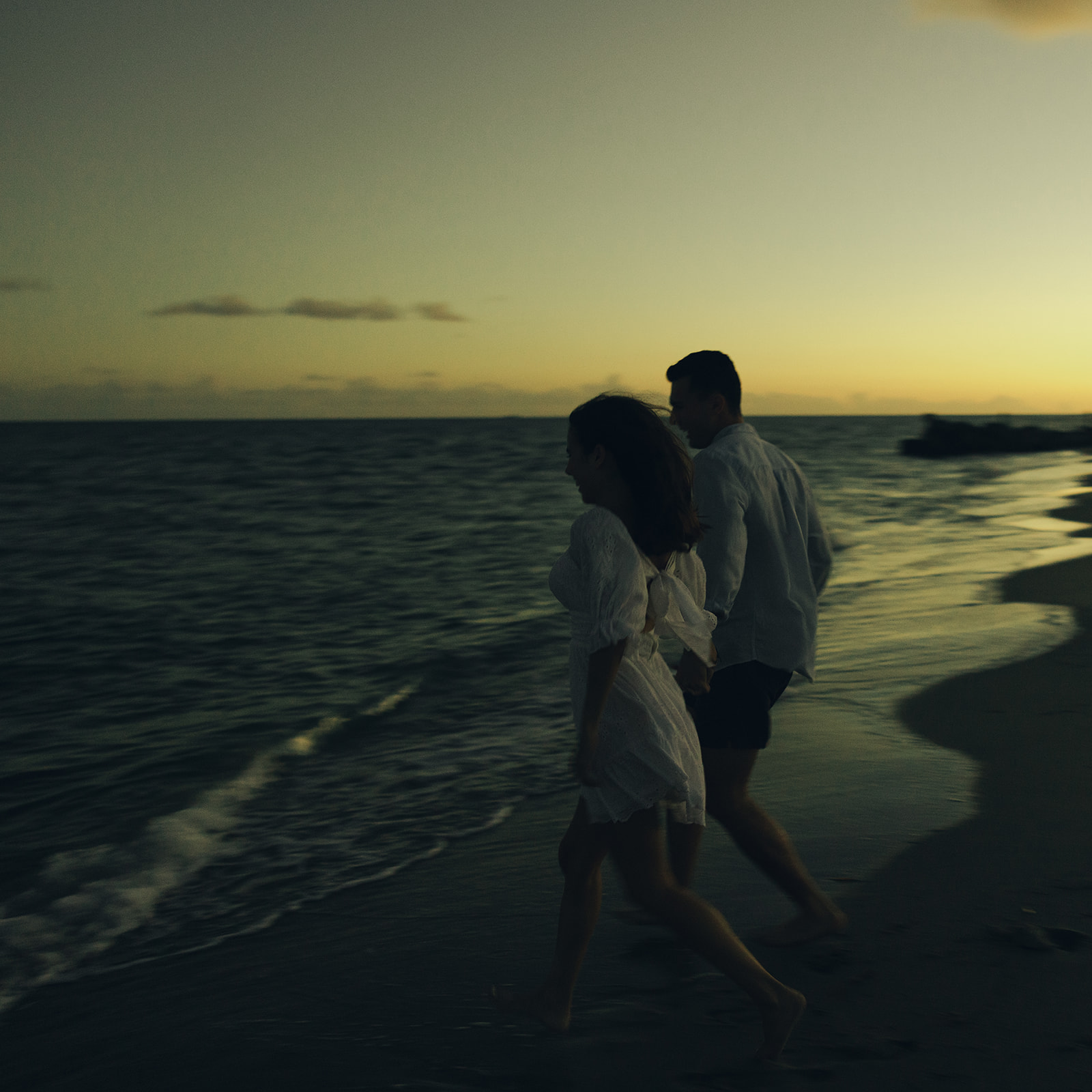 Candid Couples Engagement Session In Miami Beach Running into Water