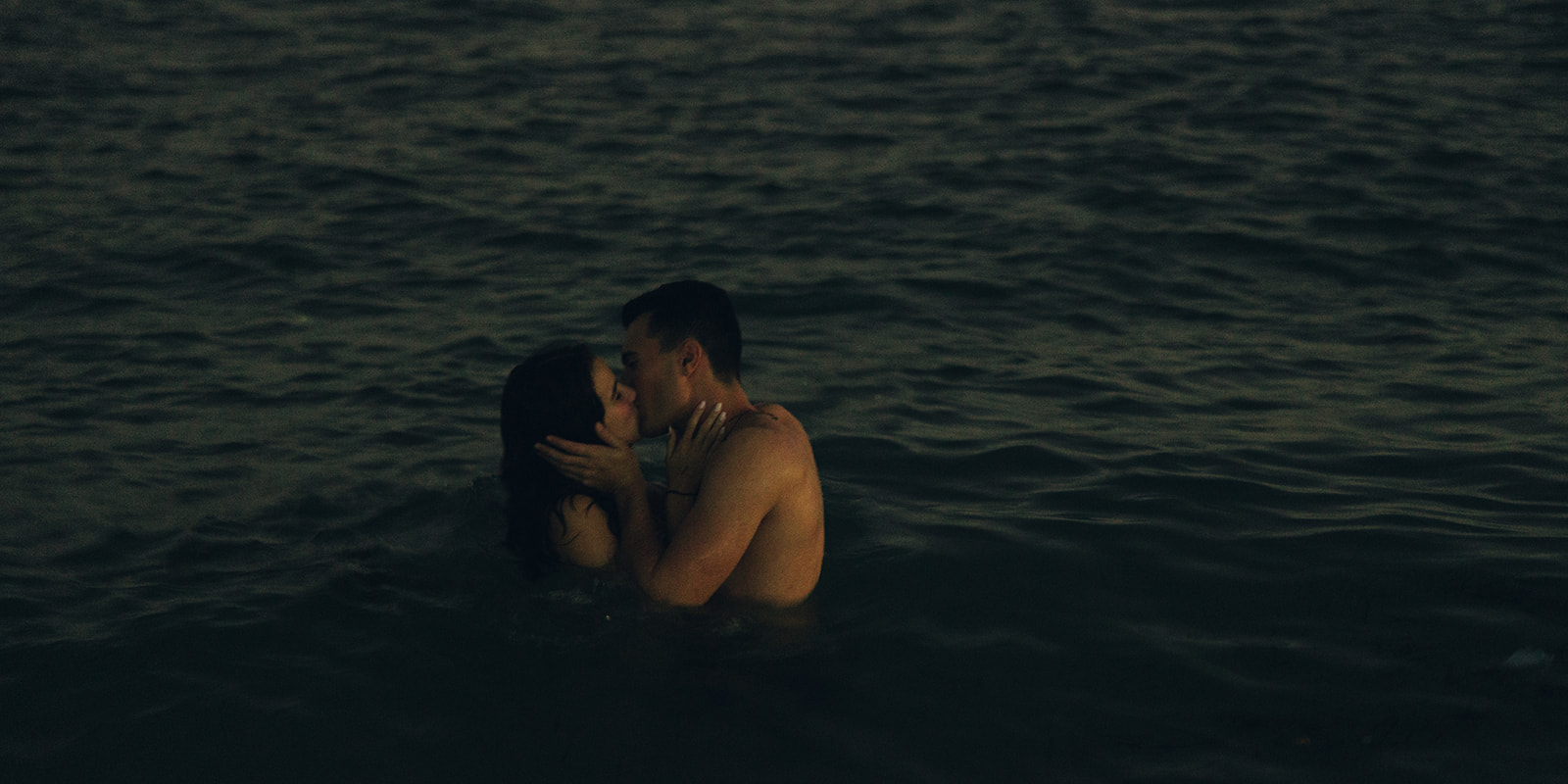 Candid  kissing in Water Couples Engagement Session In Miami Beach 