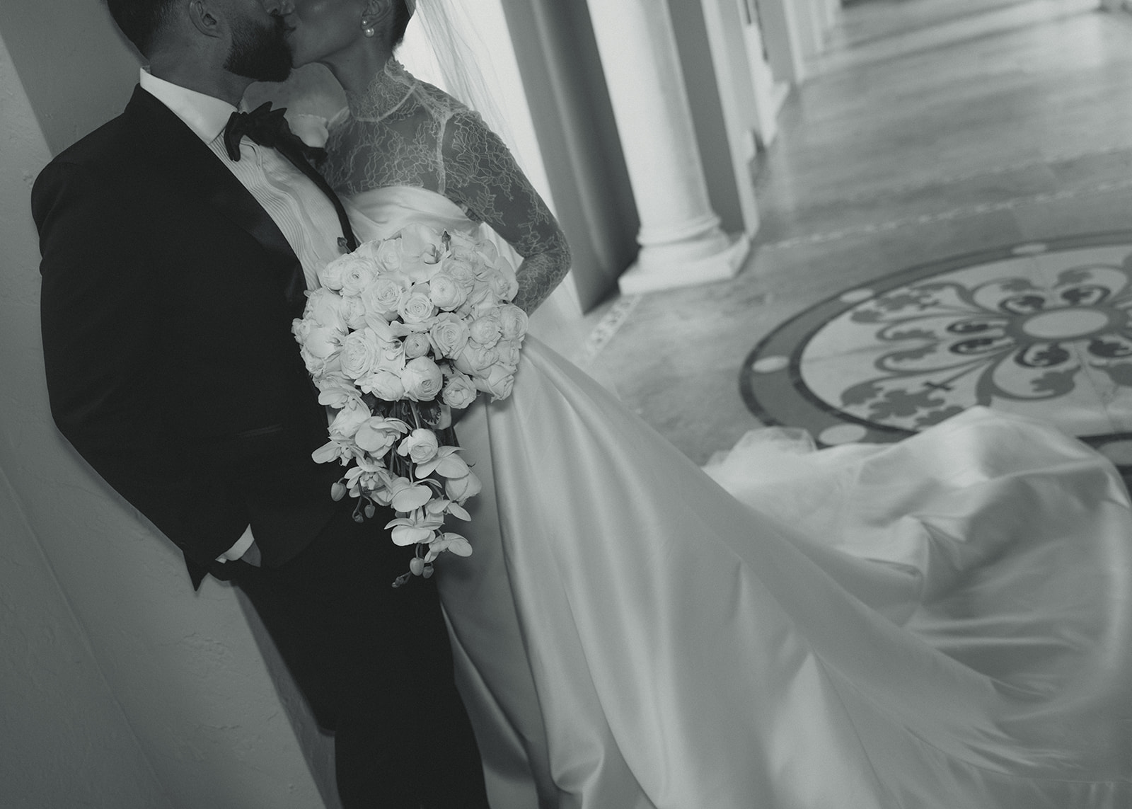 Bride and Groom Kissing Wedding Details. White Roses & Orchids Bouquet. JW Marriott Turnberry in Miami Florida. Black and White