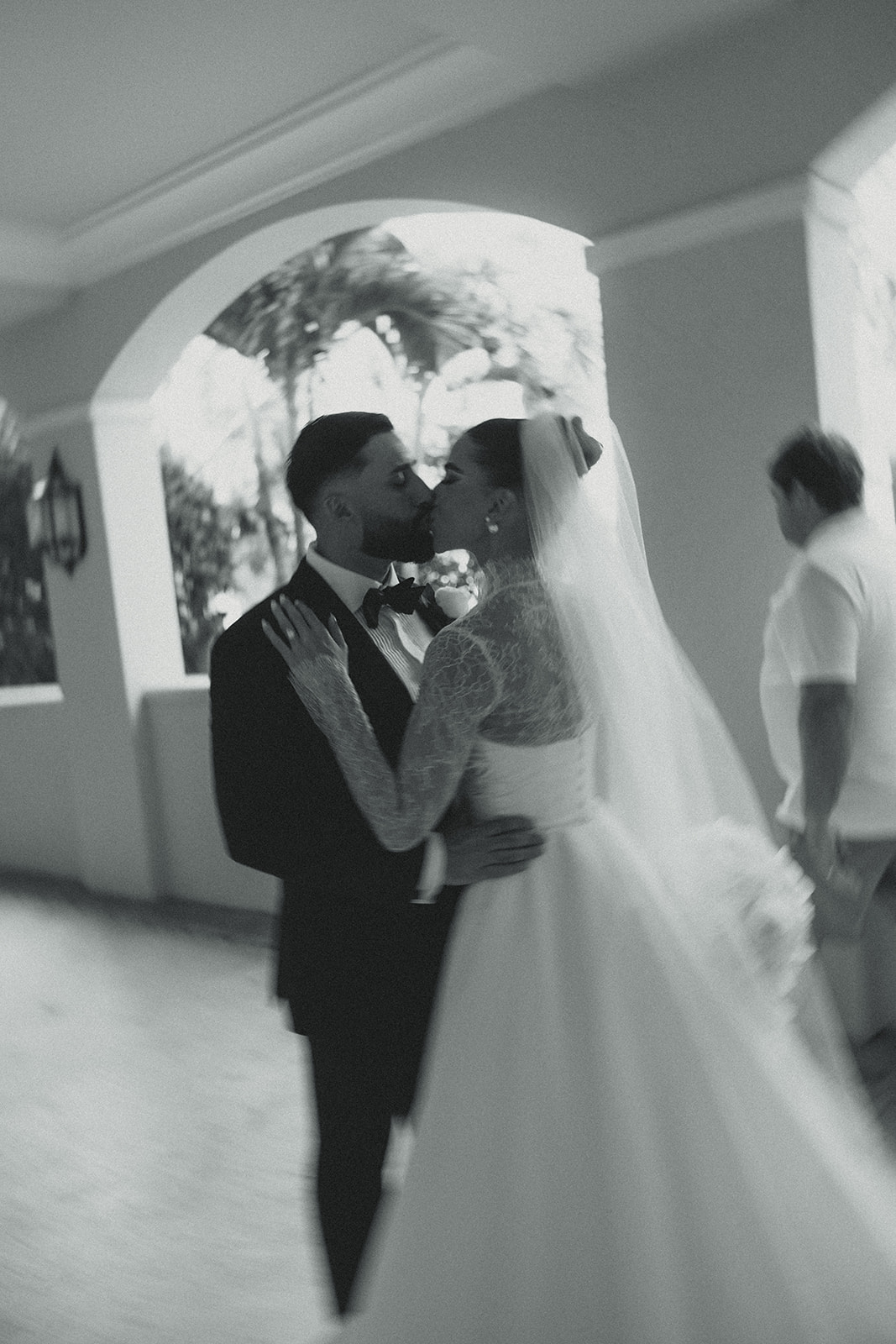 Bride and Groom Kissing Motion Blur Wedding Portraits.  JW Marriott Turnberry in Miami Florida. Black and White