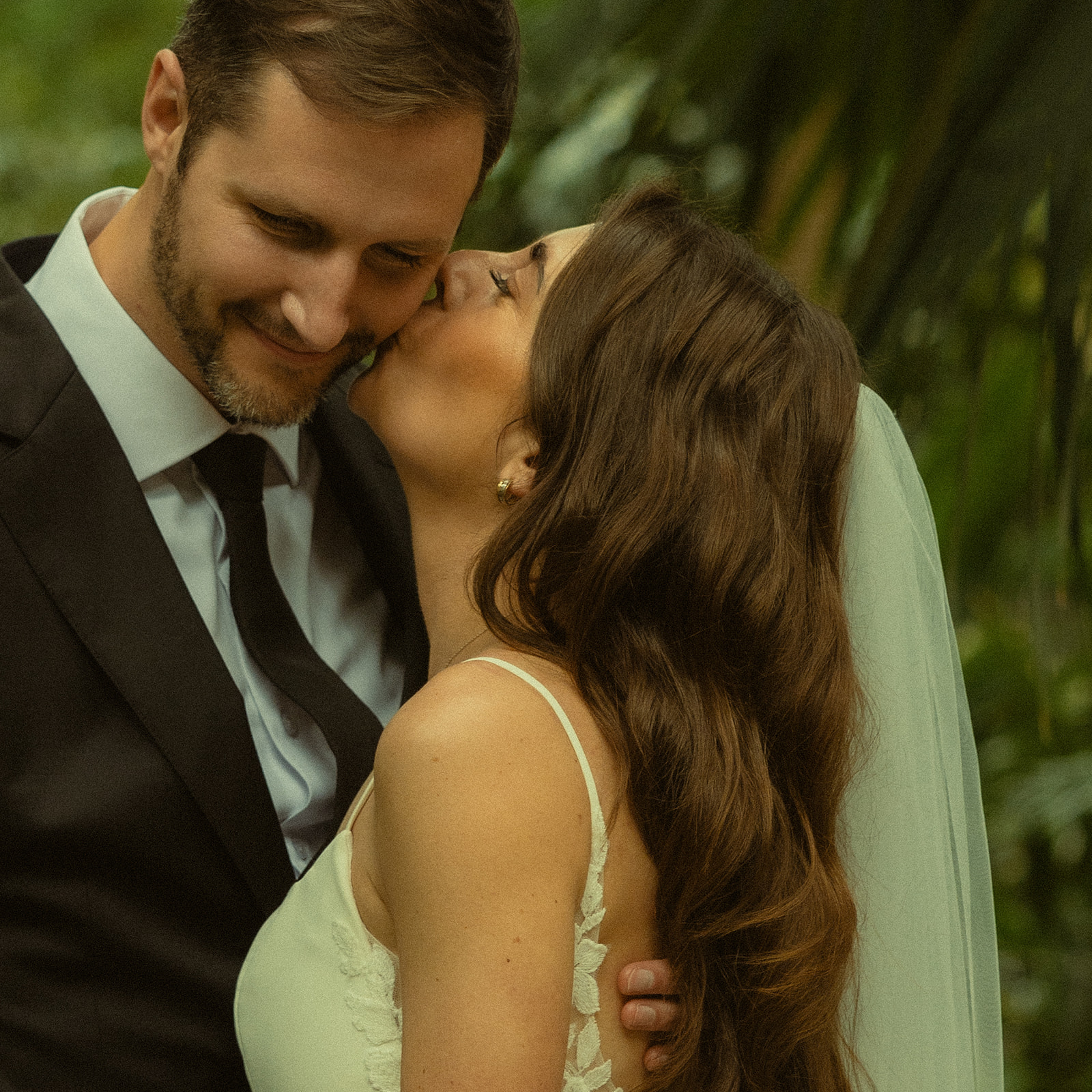 Newly Wed Portraits in St.Petersburg Bride Kissing Groom