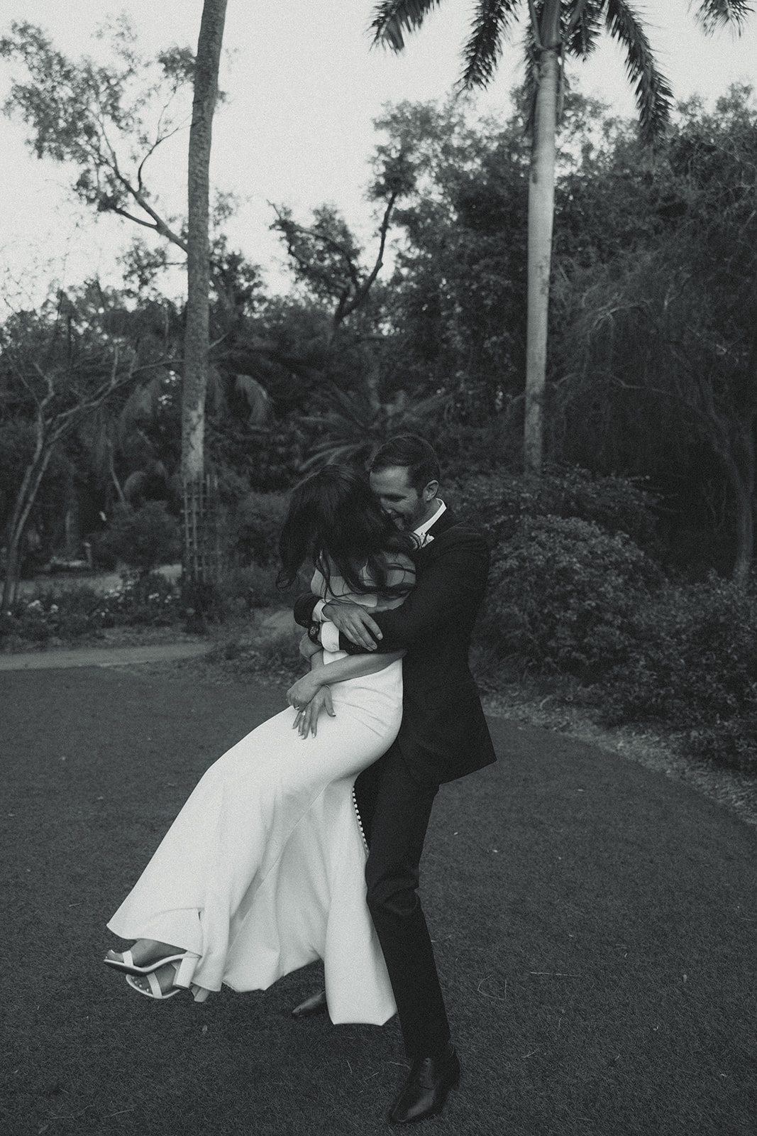 Playful Newly Wed Portraits in St.Petersburg Garden Wedding Black and White