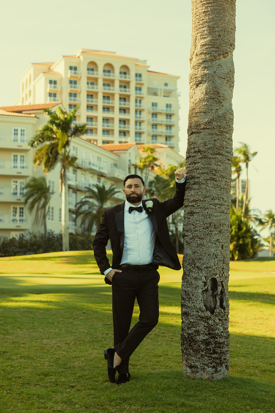 Classic Editorial Groom Portraits in JW Marriott Turnberry in Aventura Against Tree Trunk Bark