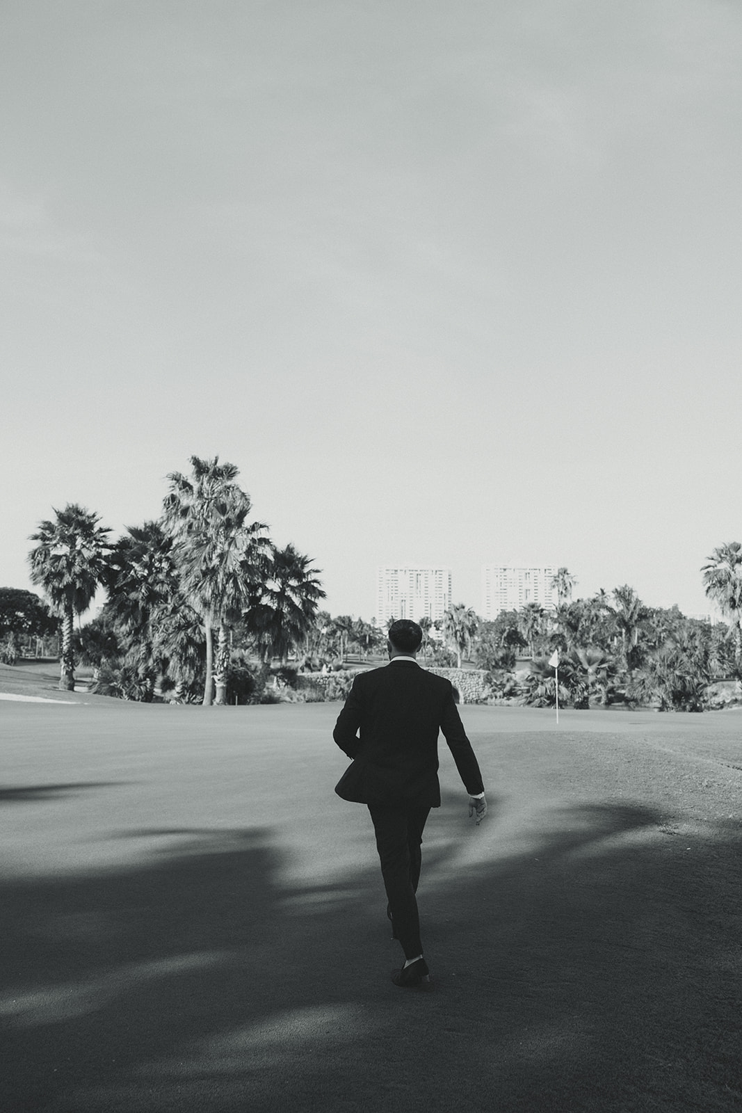 Groom Candid Walking in JW Marriott Turnberry Golf Course in Aventura.