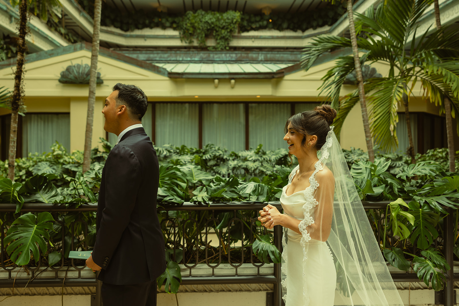 Bride and Groom Laughing during First Look Timeless Wedding in Mayfair Hotel & Garden