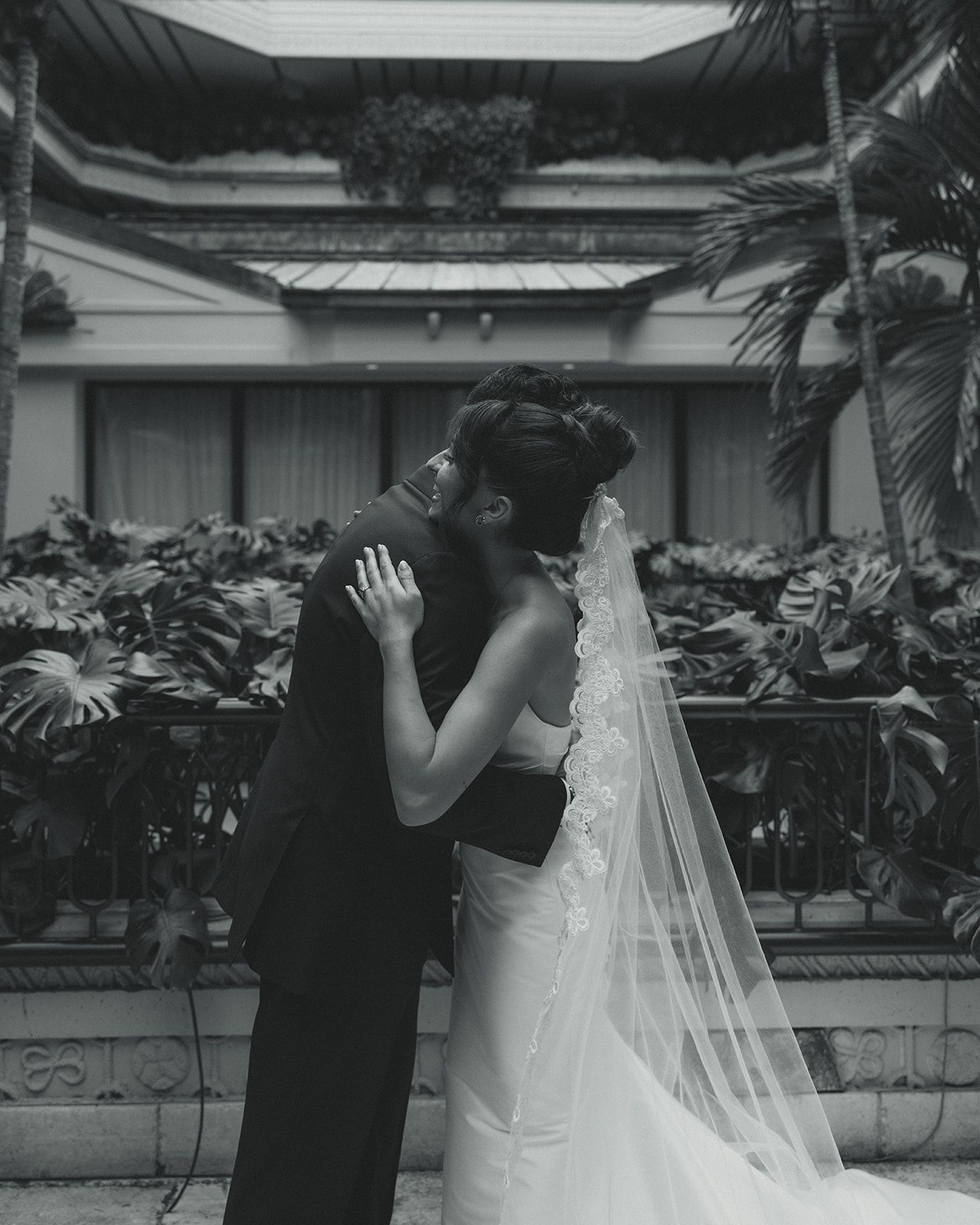 Bride and Groom First Look Hugging in Black and White Timeless Wedding in Mayfair Hotel & Garden