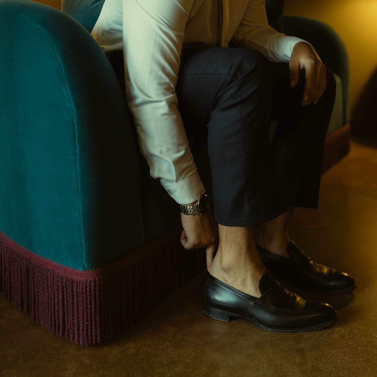 Groom Getting Ready Putting Loafers Timeless Wedding in Mayfair Hotel & Garden