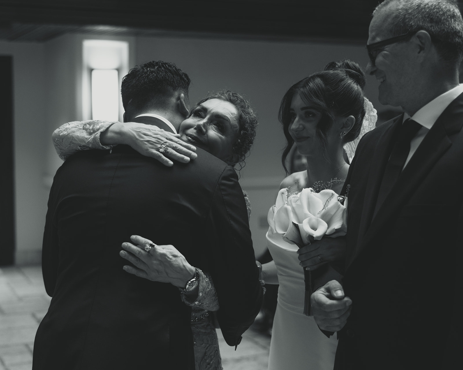 Groom hugging mother in law wedding ceremony Timeless Wedding in Mayfair Hotel & Garden