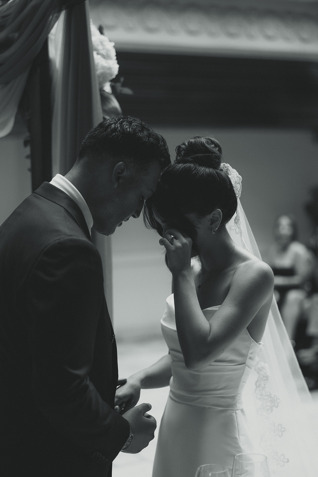 Wedding ceremony Bride Tearing Up and Groom Praying Timeless Wedding in Mayfair Hotel & Garden Black and White