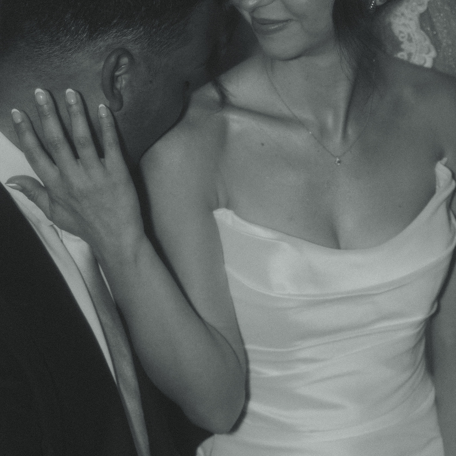 Groom Kissing Bride Shoulder Close up Wedding Portraits Timeless Wedding in Mayfair Hotel & Garden Black and White