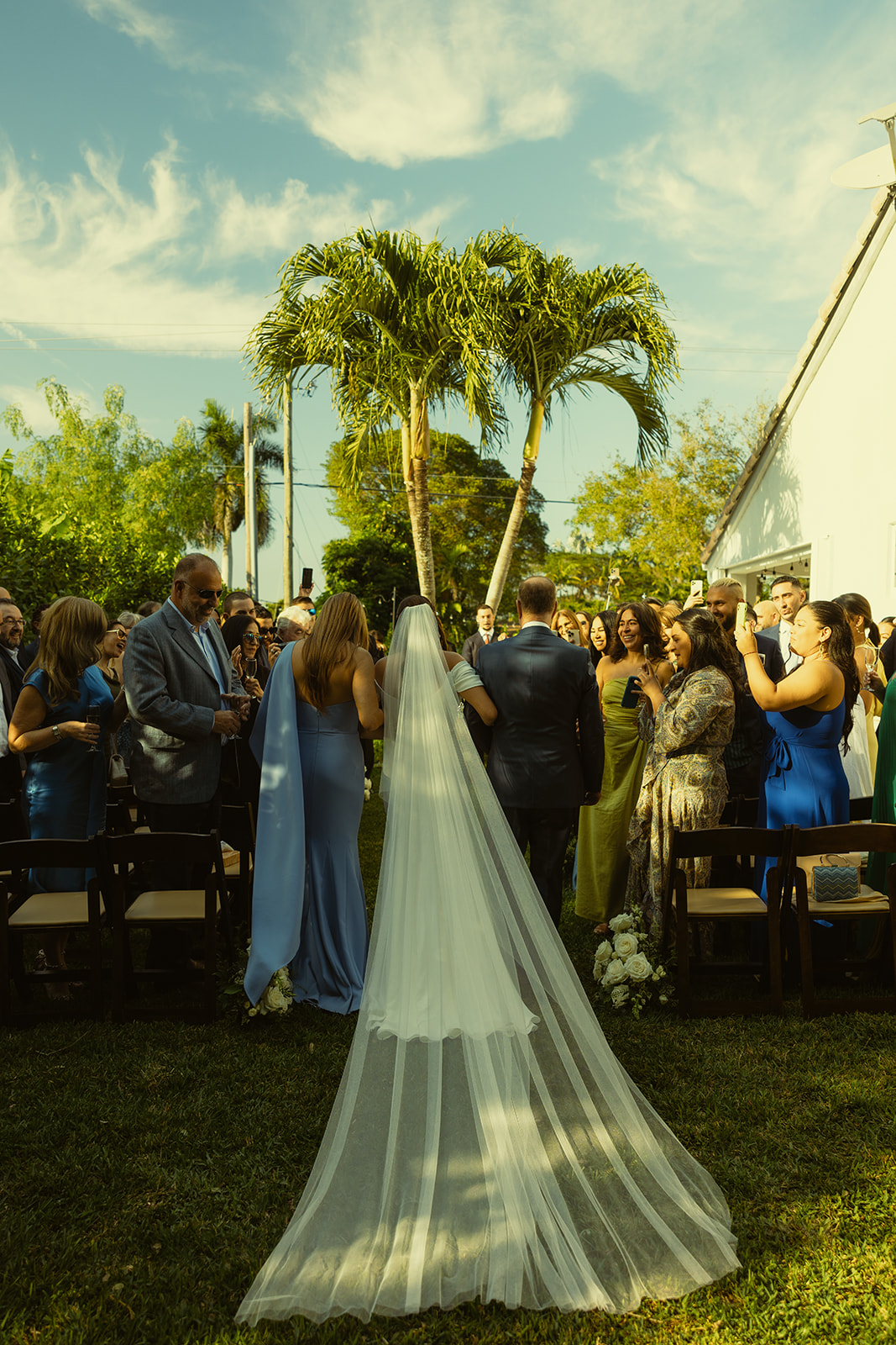 Bride walking wedding ceremony dreamy and elevated intimate backyard wedding by Aileen Ayala Photography