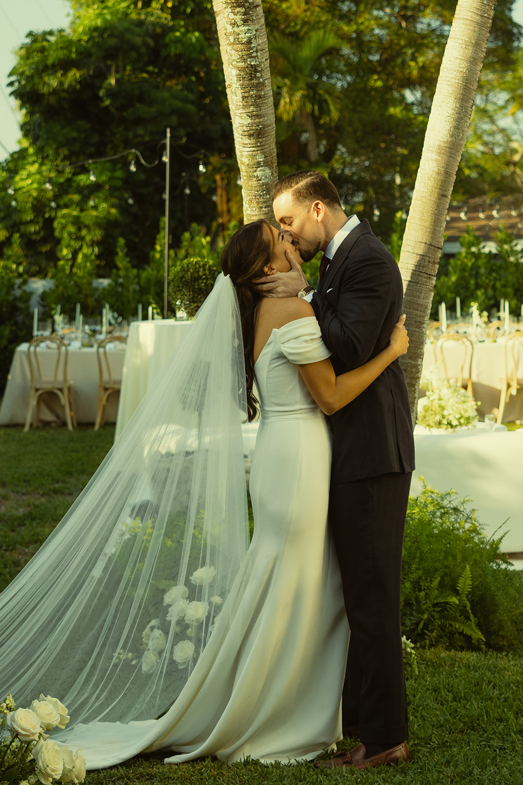 Newly weds first kiss wedding ceremony dreamy and elevated intimate backyard wedding by Aileen Ayala Photography